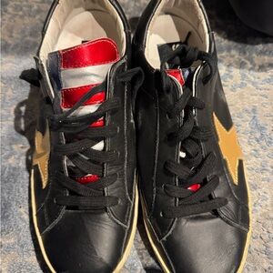 Black Golden Goose Sneakers with Gold Star and flag tongue